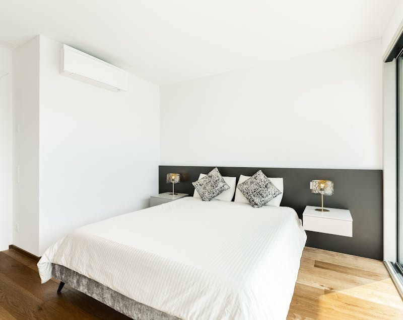 a bedroom with an AC