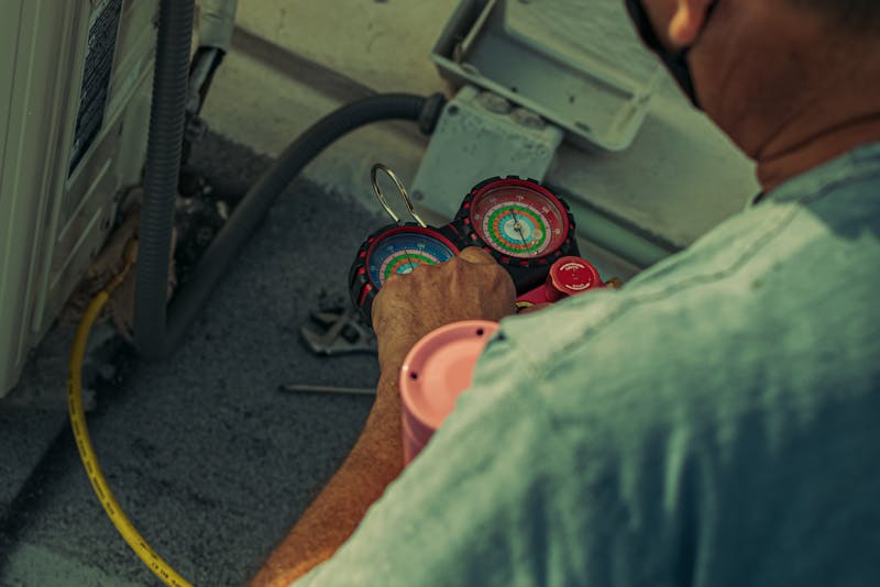 an HVAC technician doing his job
